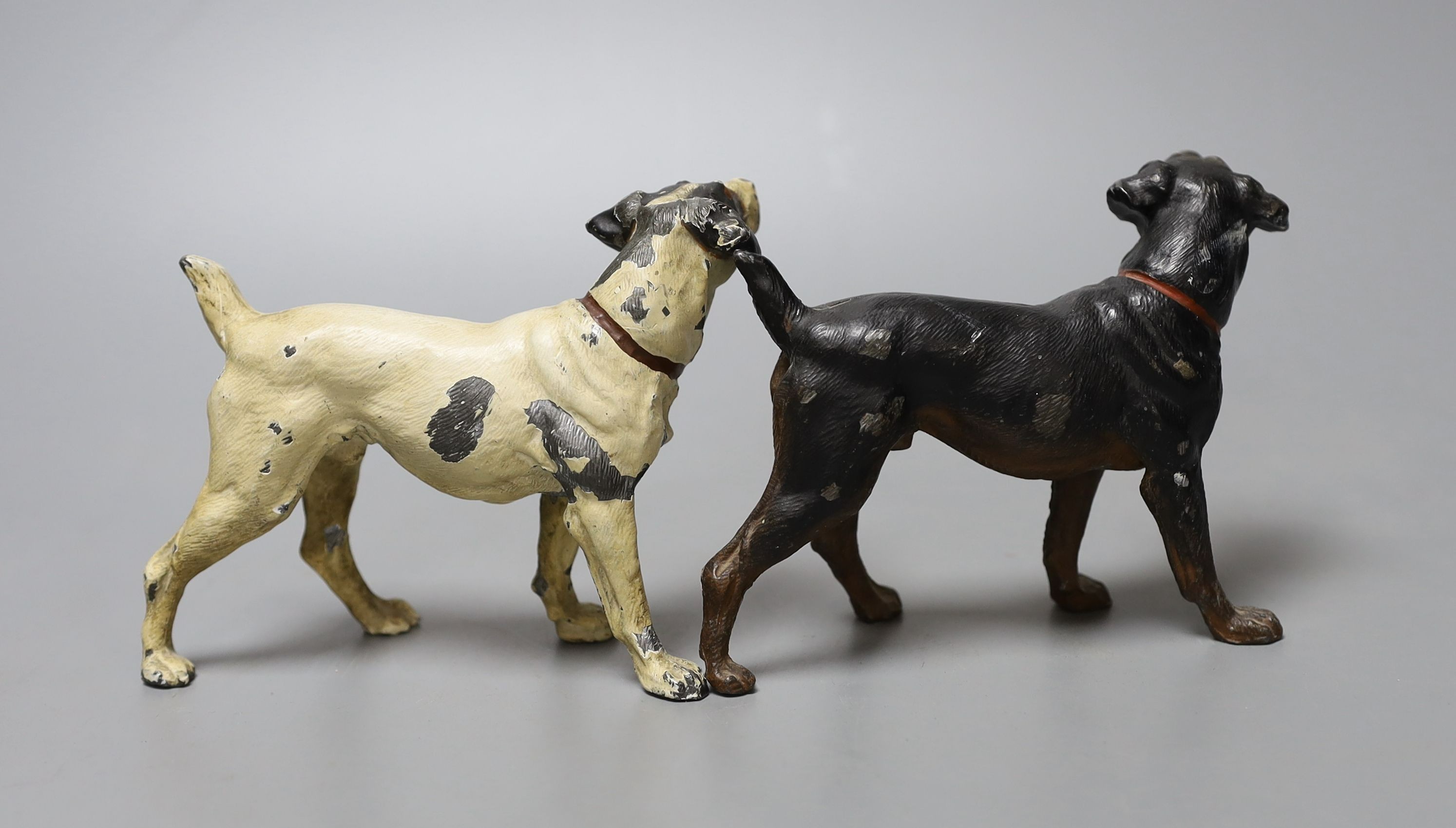 Two cold-painted spelter dogs, 9cm high